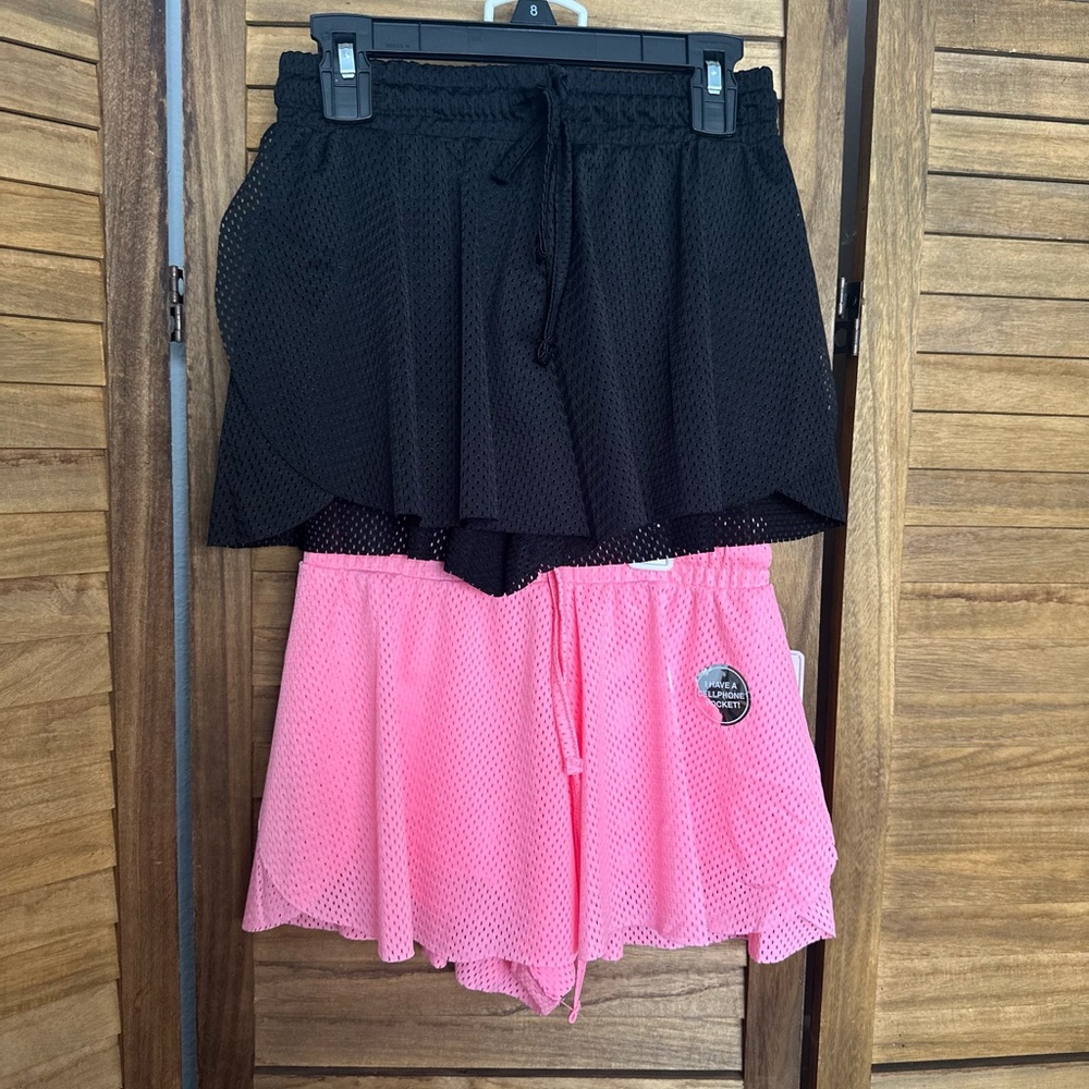 Pair of Stylish Kids Black and Pink Shorts size 8 perfect for activewear.